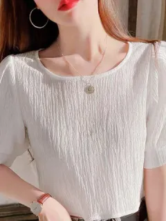 Blusa de manga corta con textura sólida