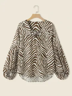 Blusa con cordones y estampado de cebra