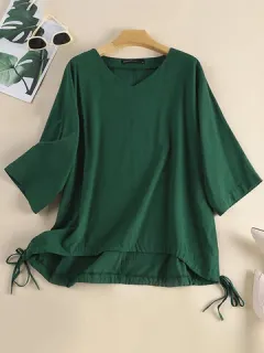 Blusa de algodón liso con lazo lateral