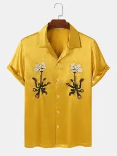Shirts with embroidered plant graphics